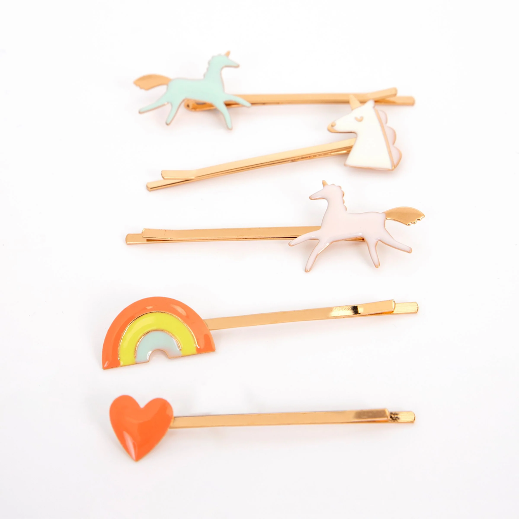 A set of colorful hair clips featuring whimsical enamel unicorn designs, perfect for adding a magical touch to any hairstyle.