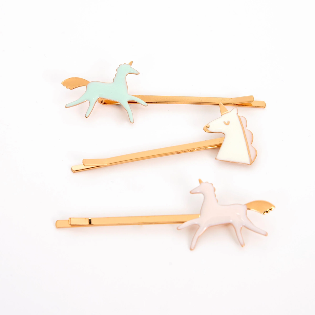 A set of colorful hair clips featuring whimsical enamel unicorn designs, perfect for adding a magical touch to any hairstyle.