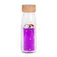  A sensory bottle filled with purple liquid, featuring two small unicorn figures and a rainbow floating inside.