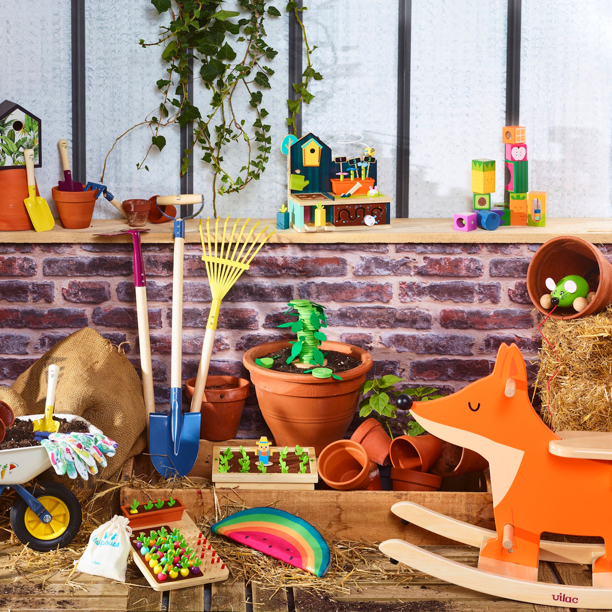 Colorful Vilac wooden garden toys, including a fox rocker, shovels, and play vegetable sets, arranged in a garden scene.
