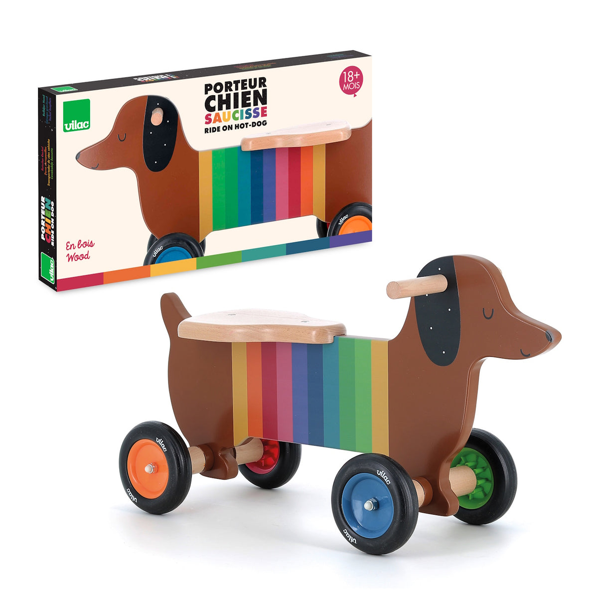 Vilac wooden dachshund ride-on toy for toddlers with rainbow stripes and colorful wheels, shown with product packaging.