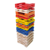 Stack of colorful Vilac Batibloc wooden building blocks arranged in a tall tower on a white background.
