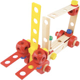 Wooden forklift construction toy made of colorful building blocks, nuts, and bolts on a white background.
