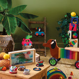 Vilac colorful wooden toys featuring a crocodile car, dachshund ride-on, and tea set in a playroom.