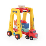 Vilac wooden gantry crane loading colorful toy shipping containers onto a red semi truck, white background.