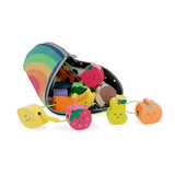Wooden fruit lacing beads with cute faces spilling out of a rainbow zippered storage pouch.