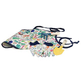Vilac kids gardening set with a colorful vegetable-print apron, patterned gloves, yellow trowel, and rake.