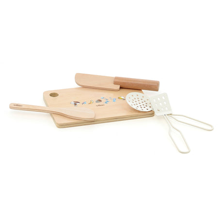 Vilac toy wooden cutting board and utensils set, including a knife, spatula, skimmer, and ladle.