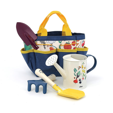 Vilac kids gardening set with blue tote bag, watering can, trowel, and rake featuring vegetable illustrations.