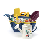 Vilac kids garden tool set with colorful metal shovel, rake, trowel, watering can, and patterned blue tote bag.