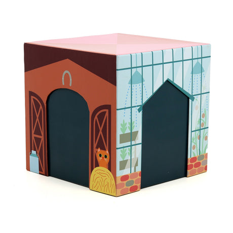 Vilac toy cube building featuring a barn with an orange cat and a greenhouse illustration.