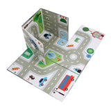 Vilac pop-up rescue play set unfolded into a toy city road mat with streets and parking.