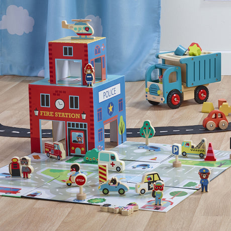 Wooden emergency rescue play set with a fire station, police station, road mat, and toy vehicles.