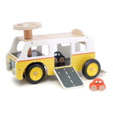 Yellow and white wooden toy camper van with fold-out ramp and two small toy cars for toddlers.