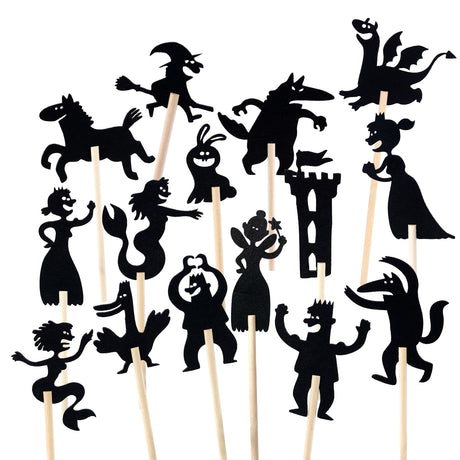 Fairytale shadow puppets on wooden sticks featuring a dragon, witch, princess, fairy, and castle.