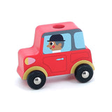Red wooden toy car with a driver in a black bowler hat, featuring black wheels and gold accents on a white background.