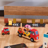 Wooden toy car carrier truck transporting colorful cars on a play track with a checkered racing finish line.