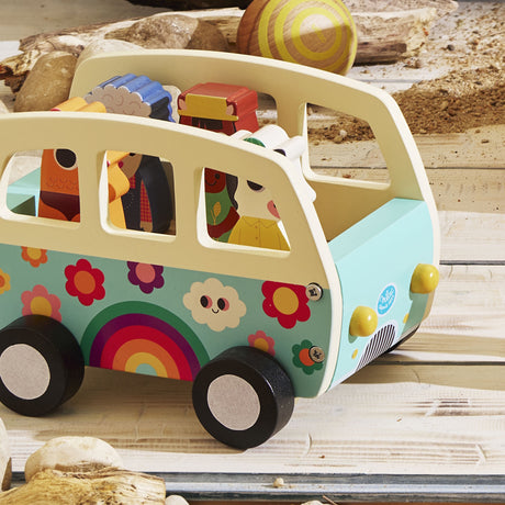 Vilac wooden toy camper bus with colorful rainbow design, filled with wooden animal figures.