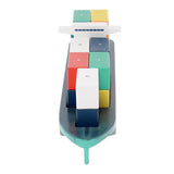 Wooden toy cargo ship with colorful shipping containers on deck on white background.