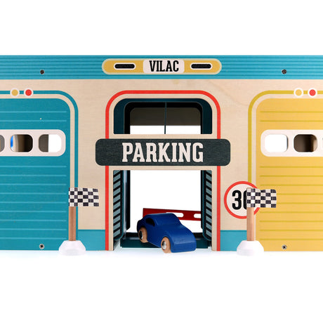 Vilac wooden toy garage "Parking" entrance with a blue toy car and checkered racing flags on a white background.