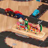 Vilac wooden toy town set with a train station, buildings, and colorful toy cars on a black play track.