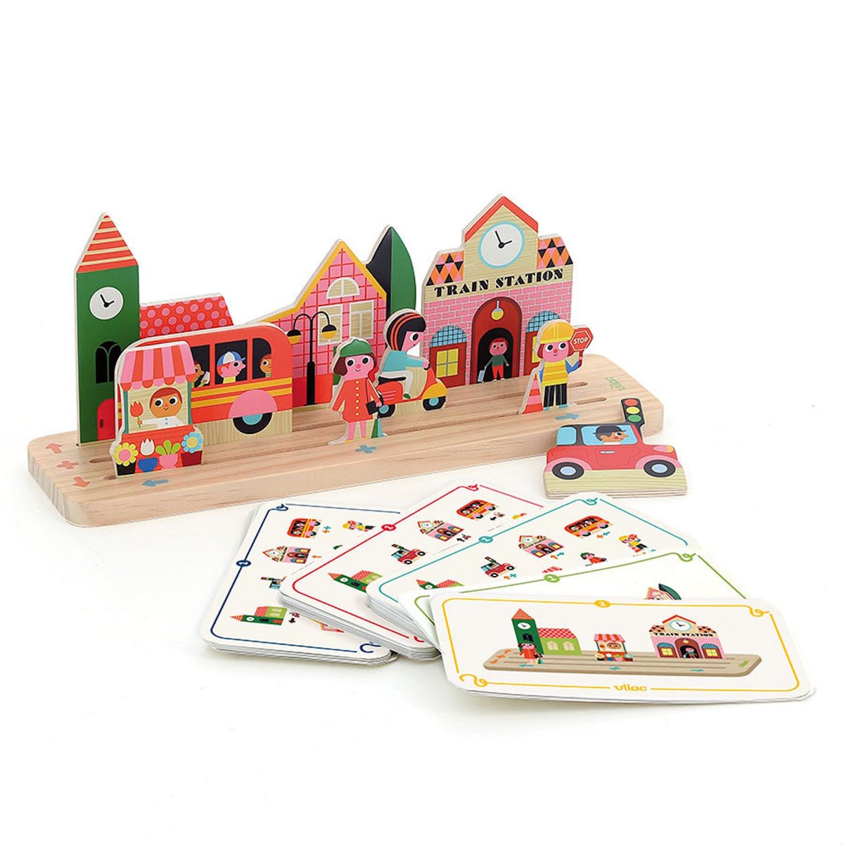 Vilac wooden city play set with building pieces, figurines, and instruction cards for spatial tracking.