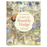 Cover of "A Visit to Brambly Hedge" by Jill Barklem. Illustrations of mice in a hedgerow, gathering blackberries, with a whimsical and cozy tone.
