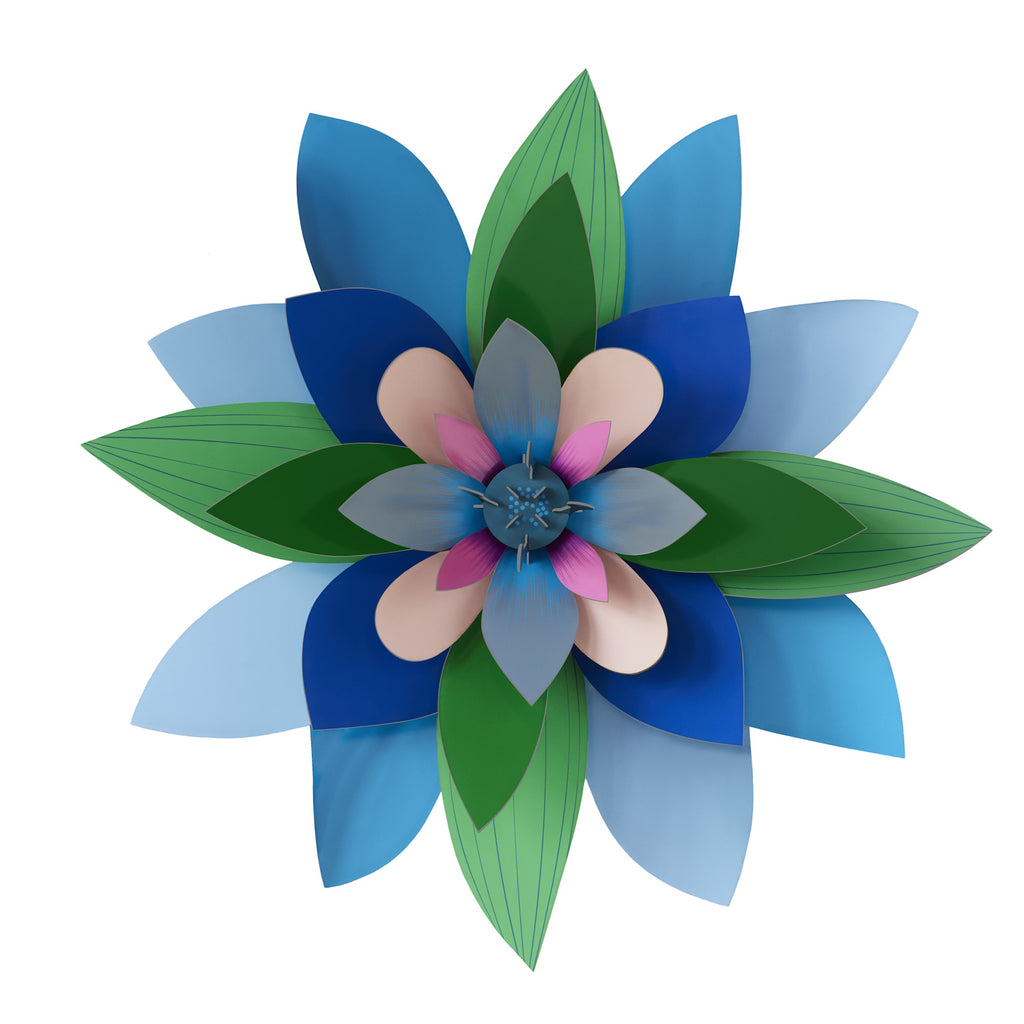 A symmetrical flower with layered, multicolored paper petals in shades of blue, green, pink, and beige, creating a vibrant, artistic pattern.
