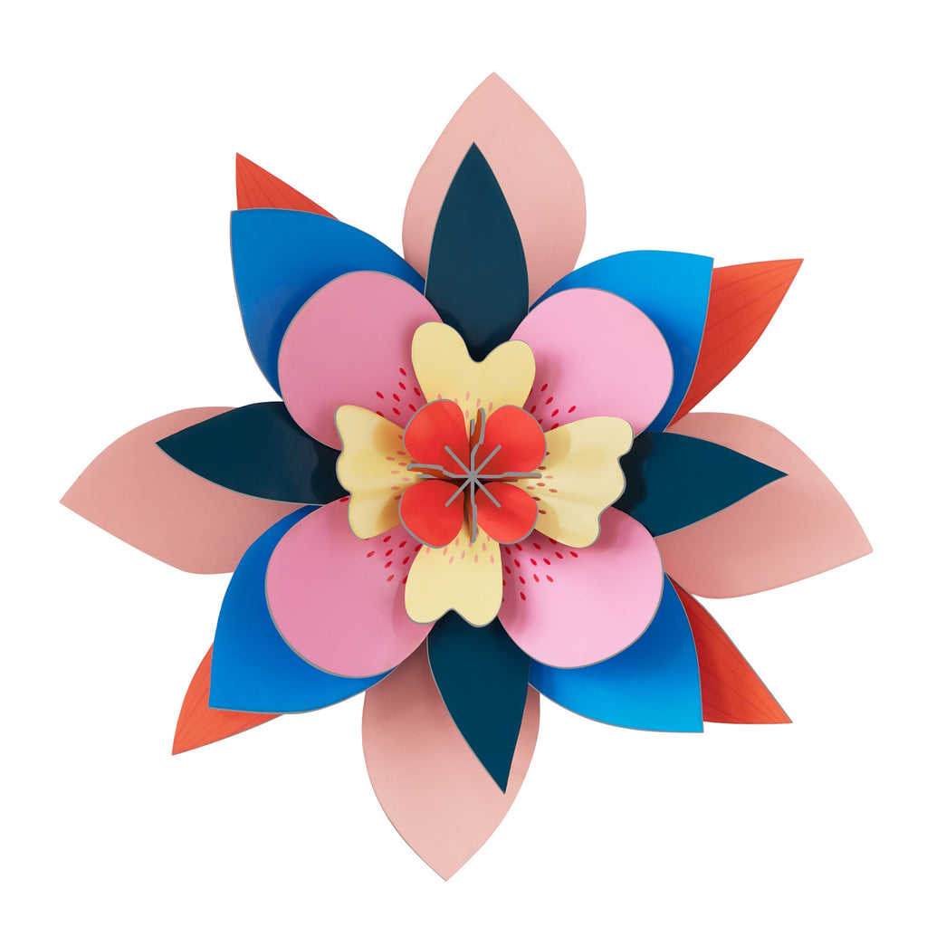 A vibrant, symmetrical, layered paper flower with petals in pink, blue, red, and dark shades, exuding a cheerful and artistic tone.