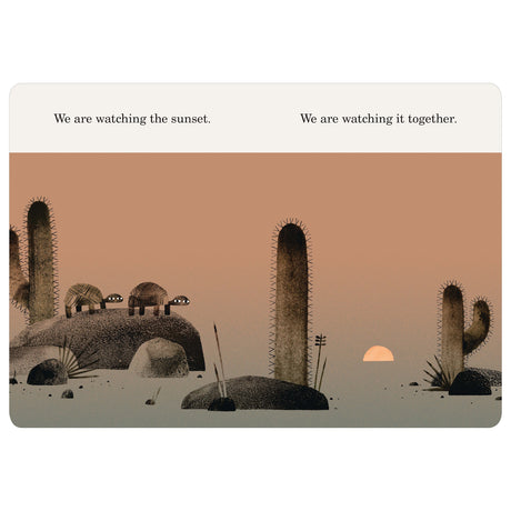 Two turtles watching the sunset together in a desert with cacti. Illustration from We Found a Hat by Jon Klassen.