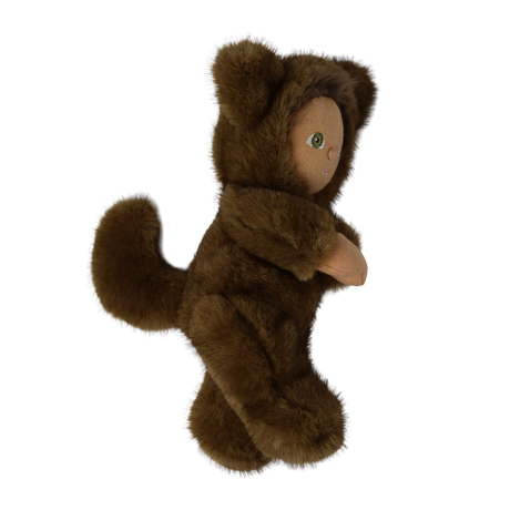 Side profile of a plush doll in a fuzzy brown werewolf suit showing its tail and ears.