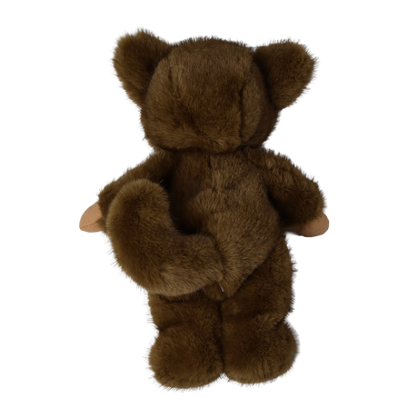 Back view of a plush doll in a fuzzy brown werewolf suit showing its tail and bear ears.