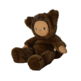 Seated plush doll in a brown werewolf costume angled to the side against a white background.