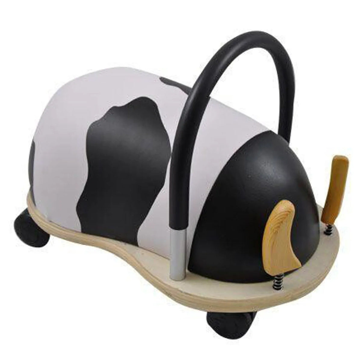 Rear-right view of the cow Wheely Bug ride-on toy, showing its curved black handle, black-and-white patterned body, and wooden base.