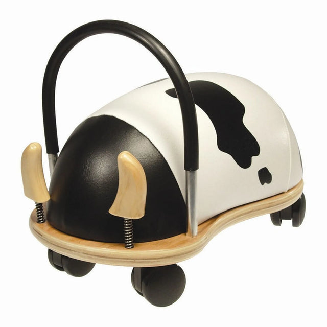 Cow Wheely Bug ride-on toy with black and white spots, wooden base, and a handle.