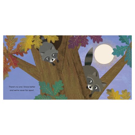 Children's book page showing two raccoons in an autumn tree under a full moon, with text about being together.