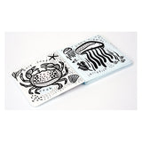 Black and white bath book for babies featuring simple illustrations of a crab and a jellyfish with sea-themed text.