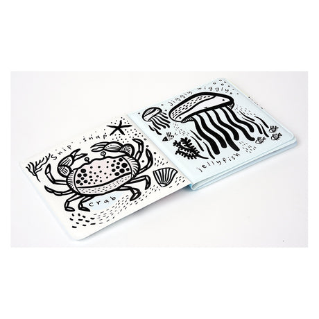 Black and white bath book for babies featuring simple illustrations of a crab and a jellyfish with sea-themed text.