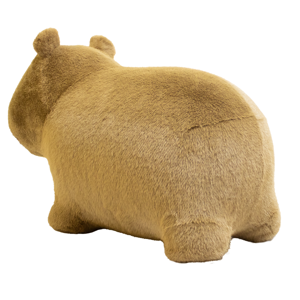 Cute, plush capybara toy against a white background. The toy has soft, golden-brown fur, a rounded snout, and tiny ears, giving a cozy and endearing appearance.
