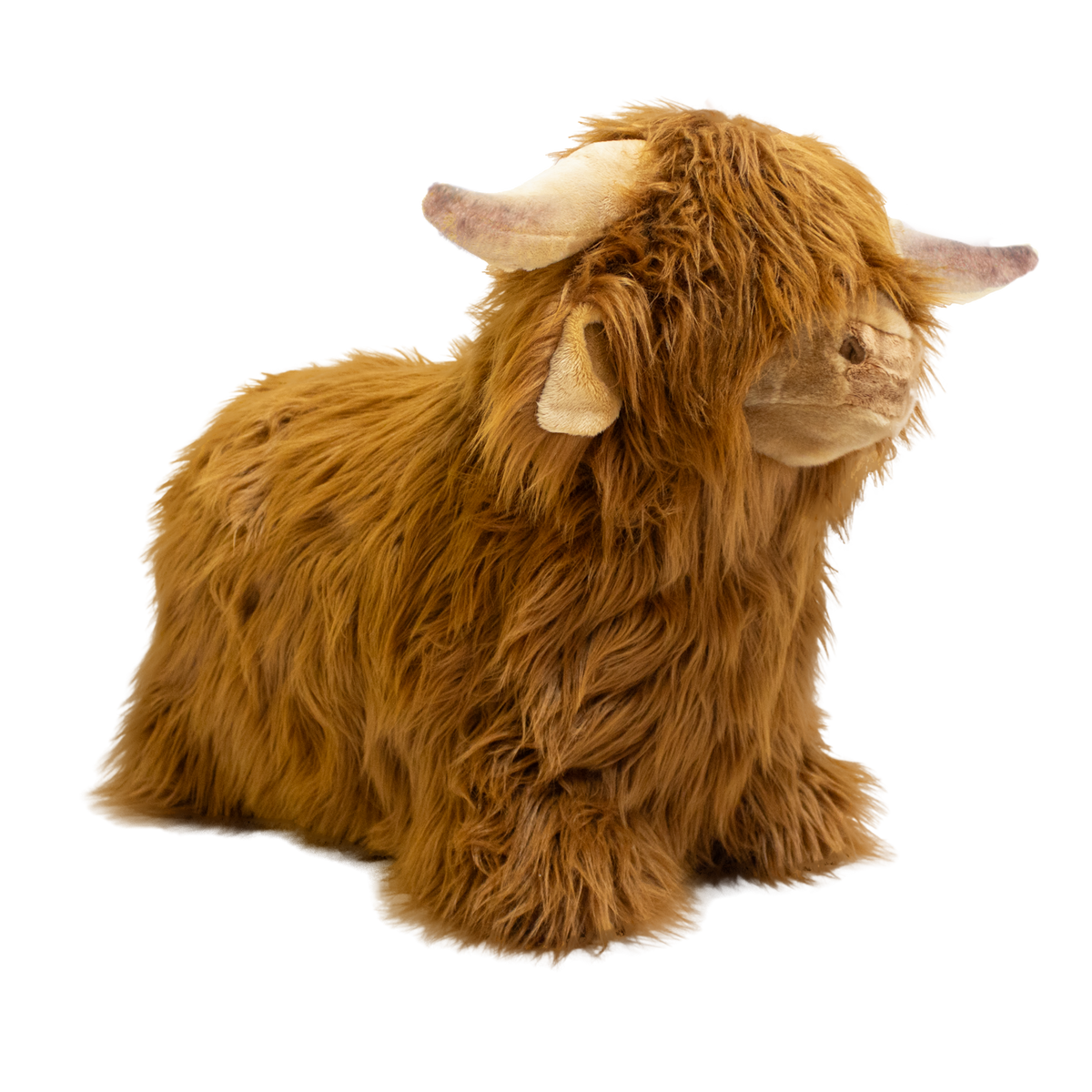 Fluffy brown plush toy resembling a Highland cow, with long fur and curved horns, set against a white background, conveying a cozy and whimsical feel.