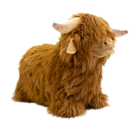Fluffy brown plush toy resembling a Highland cow, with long fur and curved horns, set against a white background, conveying a cozy and whimsical feel.
