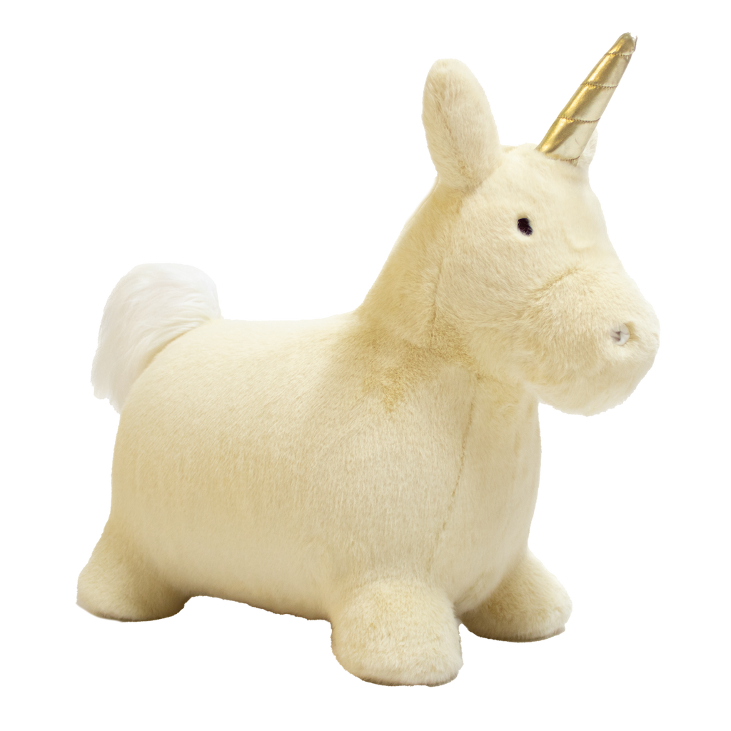 A plush unicorn toy with a golden horn and fluffy white mane and tail stands against a white background. The unicorn has a soft, cuddly appearance.