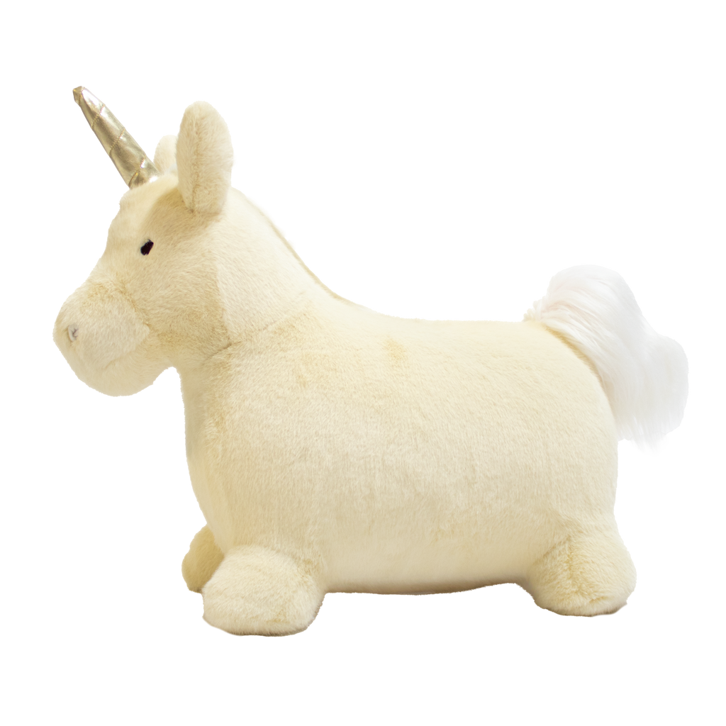 A plush unicorn toy with a golden horn and fluffy white mane and tail stands against a white background. The unicorn has a soft, cuddly appearance.