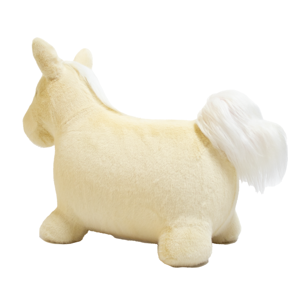 A plush unicorn toy with a golden horn and fluffy white mane and tail stands against a white background. The unicorn has a soft, cuddly appearance.
