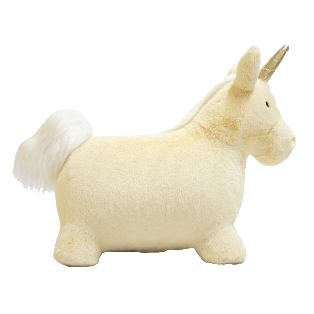 A plush unicorn toy with a golden horn and fluffy white mane and tail stands against a white background. The unicorn has a soft, cuddly appearance.