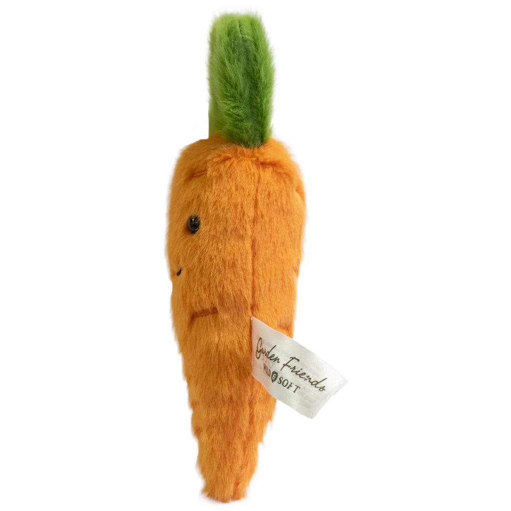 Cute plush carrot with vibrant orange body and fluffy green top. Features a smiling face and small, embroidered details on a white background.