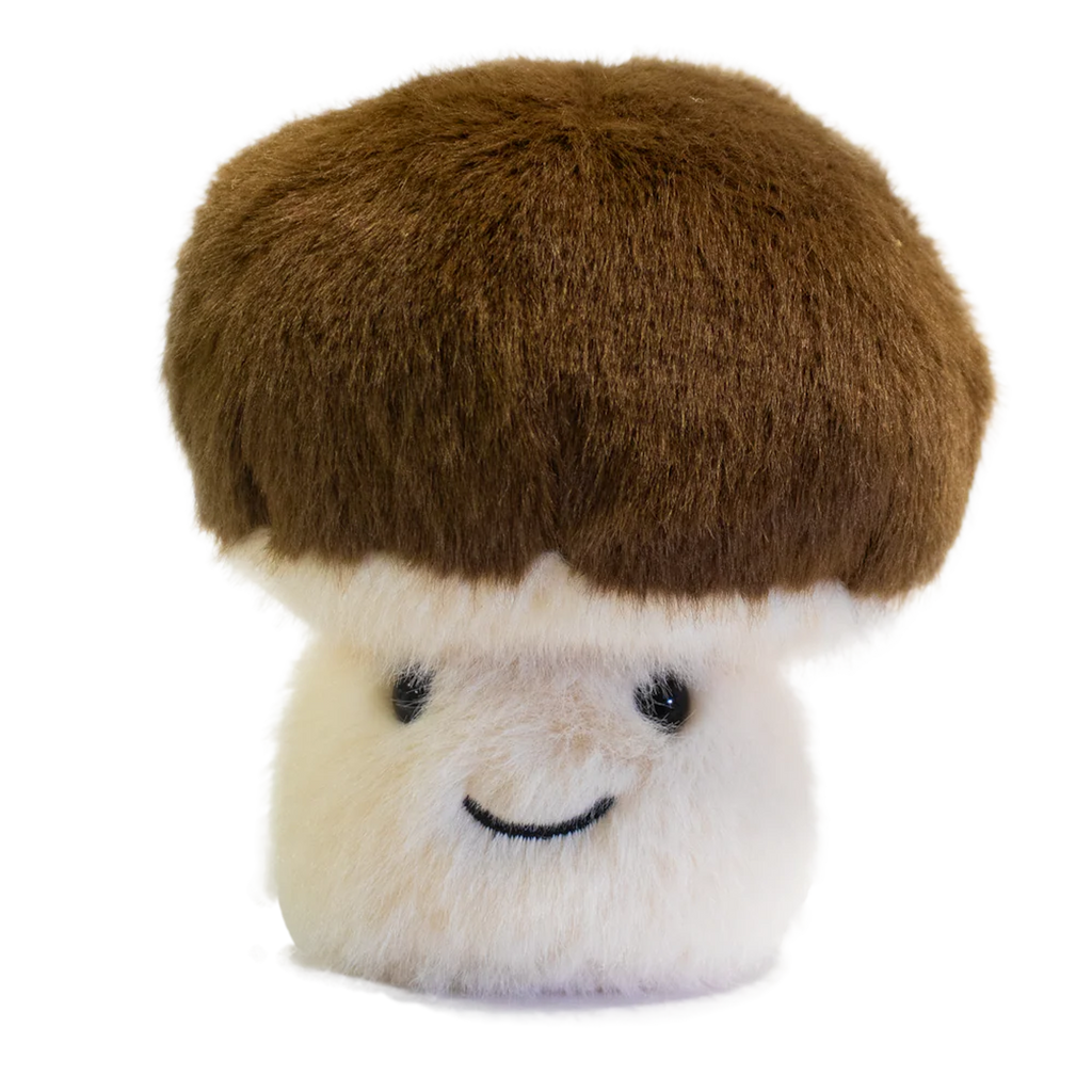 A plush toy shaped like a mushroom with a fluffy white stem and a round, brown cap. It has a smiling face, exuding a cute and cheerful vibe.