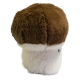 A plush toy shaped like a mushroom with a fluffy white stem and a round, brown cap. It has a smiling face, exuding a cute and cheerful vibe.