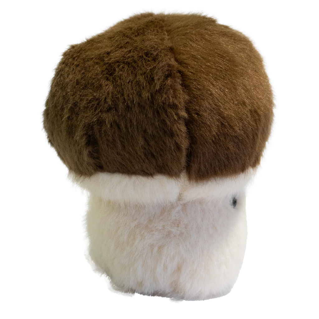 A plush toy shaped like a mushroom with a fluffy white stem and a round, brown cap. It has a smiling face, exuding a cute and cheerful vibe.