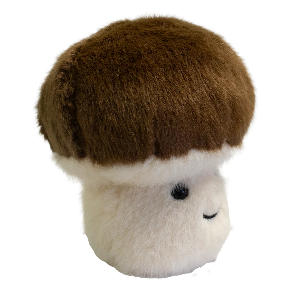 A plush toy shaped like a mushroom with a fluffy white stem and a round, brown cap. It has a smiling face, exuding a cute and cheerful vibe.